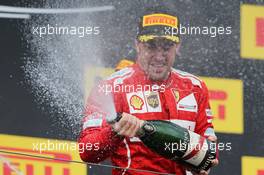 Fernando Alonso (ESP) Ferrari celebrates his second position with the champagne on the podium. 27.07.2014. Formula 1 World Championship, Rd 11, Hungarian Grand Prix, Budapest, Hungary, Race Day.