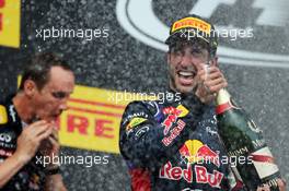 Race winner Daniel Ricciardo (AUS) Red Bull Racing celebrates with the champagne on the podium. 27.07.2014. Formula 1 World Championship, Rd 11, Hungarian Grand Prix, Budapest, Hungary, Race Day.