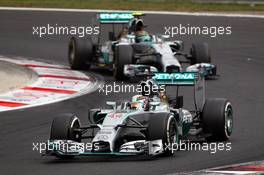Lewis Hamilton (GBR) Mercedes AMG F1 W05 leads team mate Nico Rosberg (GER) Mercedes AMG F1 W05. 27.07.2014. Formula 1 World Championship, Rd 11, Hungarian Grand Prix, Budapest, Hungary, Race Day.