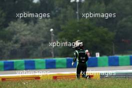 Kamui Kobayashi (JPN) Caterham runs back to the pits. 27.07.2014. Formula 1 World Championship, Rd 11, Hungarian Grand Prix, Budapest, Hungary, Race Day.