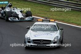 Nico Rosberg (GER) Mercedes AMG F1 W05 leads behind the FIA Safety Car. 27.07.2014. Formula 1 World Championship, Rd 11, Hungarian Grand Prix, Budapest, Hungary, Race Day.