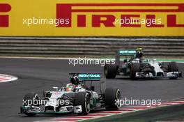 Lewis Hamilton (GBR) Mercedes AMG F1 W05 leads team mate Nico Rosberg (GER) Mercedes AMG F1 W05. 27.07.2014. Formula 1 World Championship, Rd 11, Hungarian Grand Prix, Budapest, Hungary, Race Day.