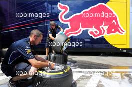 Red Bull Racing mechanics wash Pirelli tyres. 26.07.2014. Formula 1 World Championship, Rd 11, Hungarian Grand Prix, Budapest, Hungary, Qualifying Day.
