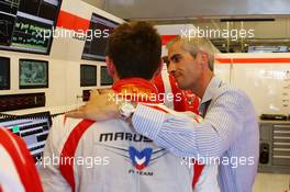 Jules Bianchi (FRA) Marussia F1 Team with Alessandro Alunni Bravi (ITA) Driver Manager. 26.07.2014. Formula 1 World Championship, Rd 11, Hungarian Grand Prix, Budapest, Hungary, Qualifying Day.
