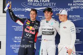 Qualifying top three in parc ferme (L to R): Sebastian Vettel (GER) Red Bull Racing, second; Nico Rosberg (GER) Mercedes AMG F1, pole position; Valtteri Bottas (FIN) Williams, third. 26.07.2014. Formula 1 World Championship, Rd 11, Hungarian Grand Prix, Budapest, Hungary, Qualifying Day.