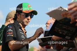 Sergio Perez (MEX) Sahara Force India F1 signs autographs for the fans. 24.07.2014. Formula 1 World Championship, Rd 11, Hungarian Grand Prix, Budapest, Hungary, Preparation Day.