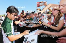 Kamui Kobayashi (JPN) Caterham signs autographs for the fans. 24.07.2014. Formula 1 World Championship, Rd 11, Hungarian Grand Prix, Budapest, Hungary, Preparation Day.