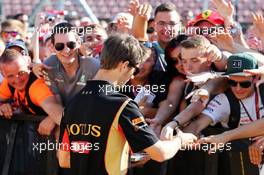 Romain Grosjean (FRA) Lotus F1 Team signs autographs for the fans. 24.07.2014. Formula 1 World Championship, Rd 11, Hungarian Grand Prix, Budapest, Hungary, Preparation Day.