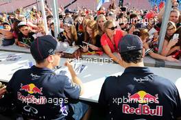 (L to R): Sebastian Vettel (GER) Red Bull Racing and team mate Daniel Ricciardo (AUS) Red Bull Racing sign autographs for the fans. 24.07.2014. Formula 1 World Championship, Rd 11, Hungarian Grand Prix, Budapest, Hungary, Preparation Day.