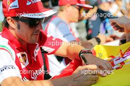 Fernando Alonso (ESP) Ferrari signs autographs for the fans. 24.07.2014. Formula 1 World Championship, Rd 11, Hungarian Grand Prix, Budapest, Hungary, Preparation Day.