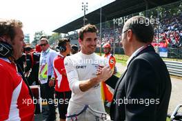 Jules Bianchi (FRA) Marussia F1 Team with Stefano Domenicali (ITA) on the grid. 07.09.2014. Formula 1 World Championship, Rd 13, Italian Grand Prix, Monza, Italy, Race Day.