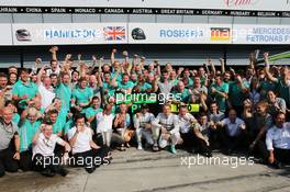 Race winner Lewis Hamilton (GBR) Mercedes AMG F1 celebrates with his step mother Linda Hamilton, father Anthony Hamilton (GBR), team mate Nico Rosberg (GER) Mercedes AMG F1, and the team.  07.09.2014. Formula 1 World Championship, Rd 13, Italian Grand Prix, Monza, Italy, Race Day.