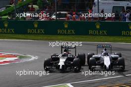 Kevin Magnussen (DEN) McLaren and Valtteri Bottas (FIN) Williams FW36. 07.09.2014. Formula 1 World Championship, Rd 13, Italian Grand Prix, Monza, Italy, Race Day.