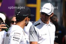 (L to R): Lewis Hamilton (GBR) Mercedes AMG F1 with Jenson Button (GBR) McLaren on the drivers parade. 07.09.2014. Formula 1 World Championship, Rd 13, Italian Grand Prix, Monza, Italy, Race Day.