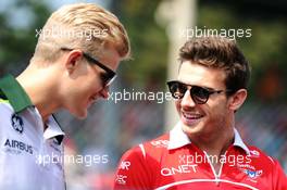 (L to R): Marcus Ericsson (SWE) Caterham with Jules Bianchi (FRA) Marussia F1 Team. 07.09.2014. Formula 1 World Championship, Rd 13, Italian Grand Prix, Monza, Italy, Race Day.