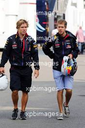 (L to R): Antti Kontsas (FIN) Red Bull Racing Physio with Sebastian Vettel (GER) Red Bull Racing. 07.09.2014. Formula 1 World Championship, Rd 13, Italian Grand Prix, Monza, Italy, Race Day.