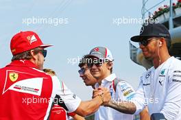 (L to R): Fernando Alonso (ESP) Ferrari with Lewis Hamilton (GBR) Mercedes AMG F1 on the drivers parade. 07.09.2014. Formula 1 World Championship, Rd 13, Italian Grand Prix, Monza, Italy, Race Day.