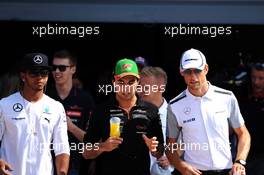 (L to R): Lewis Hamilton (GBR) Mercedes AMG F1 with Sergio Perez (MEX) Sahara Force India F1 and Jenson Button (GBR) McLaren on the drivers parade. 07.09.2014. Formula 1 World Championship, Rd 13, Italian Grand Prix, Monza, Italy, Race Day.