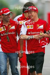 (L to R): Marc Gene (ESP) Ferrari Test Driver with Kimi Raikkonen (FIN) Ferrari. 03.10.2014. Formula 1 World Championship, Rd 15, Japanese Grand Prix, Suzuka, Japan, Practice Day.