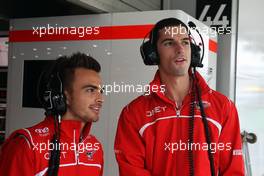 (L to R): Will Stevens (GBR) Marussia F1 Team Reserve Driver with Alexander Rossi (USA) Marussia F1 Team Reserve Driver. 05.10.2014. Formula 1 World Championship, Rd 15, Japanese Grand Prix, Suzuka, Japan, Race Day.