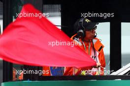 The red flag is waved as the race is stopped. 05.10.2014. Formula 1 World Championship, Rd 15, Japanese Grand Prix, Suzuka, Japan, Race Day.