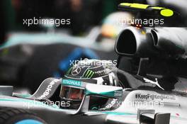 Nico Rosberg (GER) Mercedes AMG F1 W05 and team mate Lewis Hamilton (GBR) Mercedes AMG F1 W05 on the grid. 05.10.2014. Formula 1 World Championship, Rd 15, Japanese Grand Prix, Suzuka, Japan, Race Day.