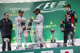 The podium (L to R): Nico Rosberg (GER) Mercedes AMG F1, second; Lewis Hamilton (GBR) Mercedes AMG F1, race winner; Sebastian Vettel (GER) Red Bull Racing, third. 05.10.2014. Formula 1 World Championship, Rd 15, Japanese Grand Prix, Suzuka, Japan, Race Day.