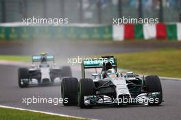 Lewis Hamilton (GBR) Mercedes AMG F1 W05 leads team mate Nico Rosberg (GER) Mercedes AMG F1 W05. 05.10.2014. Formula 1 World Championship, Rd 15, Japanese Grand Prix, Suzuka, Japan, Race Day.