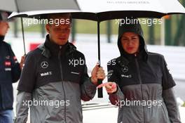 (L to R): Kevin Magnussen (DEN) McLaren and Silvia Hoffer, McLaren Press Officer, on the drivers parade. 05.10.2014. Formula 1 World Championship, Rd 15, Japanese Grand Prix, Suzuka, Japan, Race Day.