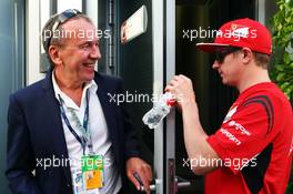 Kimi Raikkonen (FIN) Ferrari with Nikolay Vetrov (RUS) Russian GP Promoter. 10.10.2014. Formula 1 World Championship, Rd 16, Russian Grand Prix, Sochi Autodrom, Sochi, Russia, Practice Day.