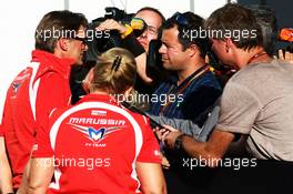 Graeme Lowdon (GBR) Marussia F1 Team Chief Executive Officer with Ted Kravitz (GBR) Sky Sports Pitlane Reporter and the media. 10.10.2014. Formula 1 World Championship, Rd 16, Russian Grand Prix, Sochi Autodrom, Sochi, Russia, Practice Day.