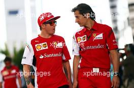 (L to R): Kimi Raikkonen (FIN) Ferrari with Massimo Rivola (ITA) Ferrari Sporting Director. 10.10.2014. Formula 1 World Championship, Rd 16, Russian Grand Prix, Sochi Autodrom, Sochi, Russia, Practice Day.