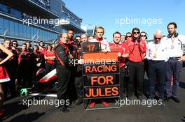 Max Chilton (GBR) Marussia F1 Team and members of the team show their support for Jules Bianchi on the grid. 12.10.2014. Formula 1 World Championship, Rd 16, Russian Grand Prix, Sochi Autodrom, Sochi, Russia, Race Day.