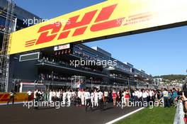 Drivers silence in respect to Jules Bianchi (FRA) Marussia F1 Team MR03. 12.10.2014. Formula 1 World Championship, Rd 16, Russian Grand Prix, Sochi Autodrom, Sochi, Russia, Race Day.