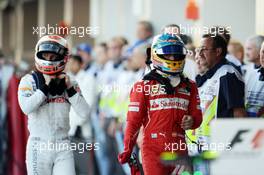 (L to R): Kevin Magnussen (DEN) McLaren and Fernando Alonso (ESP) Ferrari in parc ferme. 12.10.2014. Formula 1 World Championship, Rd 16, Russian Grand Prix, Sochi Autodrom, Sochi, Russia, Race Day.
