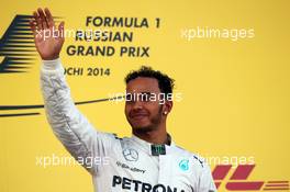 Race winner Lewis Hamilton (GBR) Mercedes AMG F1 celebrates on the podium. 12.10.2014. Formula 1 World Championship, Rd 16, Russian Grand Prix, Sochi Autodrom, Sochi, Russia, Race Day.