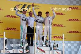 The podium (L to R): Nico Rosberg (GER) Mercedes AMG F1, second; Paddy Lowe (GBR) Mercedes AMG F1 Executive Director (Technical); Lewis Hamilton (GBR) Mercedes AMG F1, race winner; Valtteri Bottas (FIN) Williams, third. 12.10.2014. Formula 1 World Championship, Rd 16, Russian Grand Prix, Sochi Autodrom, Sochi, Russia, Race Day.