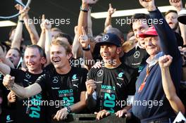 (L to R): Paddy Lowe (GBR) Mercedes AMG F1 Executive Director (Technical); Nico Rosberg (GER) Mercedes AMG F1; Lewis Hamilton (GBR) Mercedes AMG F1; Toto Wolff (GER) Mercedes AMG F1 Shareholder and Executive Director; and Niki Lauda (AUT) Mercedes Non-Executive Chairman celebrate winning the 2014 Constructors' Championship with the team. 12.10.2014. Formula 1 World Championship, Rd 16, Russian Grand Prix, Sochi Autodrom, Sochi, Russia, Race Day.