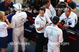 (L to R): Valtteri Bottas (FIN) Williams and Lewis Hamilton (GBR) Mercedes AMG F1 with the media. 11.10.2014. Formula 1 World Championship, Rd 16, Russian Grand Prix, Sochi Autodrom, Sochi, Russia, Qualifying Day.