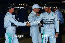 (L to R): Nico Rosberg (GER) Mercedes AMG F1 congratulates team mate and pole sitter Lewis Hamilton (GBR) Mercedes AMG F1 in parc ferme. 11.10.2014. Formula 1 World Championship, Rd 16, Russian Grand Prix, Sochi Autodrom, Sochi, Russia, Qualifying Day.