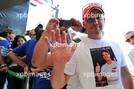 A fan wearing a Jules Bianchi (FRA) Marussia F1 Team T-Shirt at the Fanzone. 09.10.2014. Formula 1 World Championship, Rd 16, Russian Grand Prix, Sochi Autodrom, Sochi, Russia, Preparation Day.
