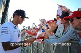 Lewis Hamilton (GBR) Mercedes AMG F1 signs autographs for the fans at the Fanzone. 09.10.2014. Formula 1 World Championship, Rd 16, Russian Grand Prix, Sochi Autodrom, Sochi, Russia, Preparation Day.