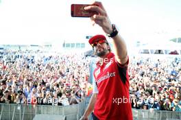 Fernando Alonso (ESP) Ferrari takes a selfie at the Fanzone. 09.10.2014. Formula 1 World Championship, Rd 16, Russian Grand Prix, Sochi Autodrom, Sochi, Russia, Preparation Day.