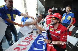 Fernando Alonso (ESP) Ferrari with fans at the Fanzone. 09.10.2014. Formula 1 World Championship, Rd 16, Russian Grand Prix, Sochi Autodrom, Sochi, Russia, Preparation Day.