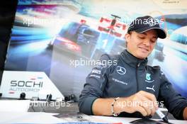 Nico Rosberg (GER) Mercedes AMG F1 signs autographs for the fans at the Fanzone. 09.10.2014. Formula 1 World Championship, Rd 16, Russian Grand Prix, Sochi Autodrom, Sochi, Russia, Preparation Day.