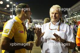 (L to R): Cyril Abiteboul (FRA) Renault Sport F1 Managing Director with Dr Helmut Marko (AUT) Red Bull Motorsport Consultant on the grid. 21.09.2014. Formula 1 World Championship, Rd 14, Singapore Grand Prix, Singapore, Singapore, Race Day.