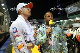 Nico Hulkenberg (GER), Sahara Force India and Kai Ebel (GER) RTL TV Presenter 21.09.2014. Formula 1 World Championship, Rd 14, Singapore Grand Prix, Singapore, Singapore, Race Day.