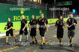 Romain Grosjean (FRA) Lotus F1 Team (Right) walks the circuit. 18.09.2014. Formula 1 World Championship, Rd 14, Singapore Grand Prix, Singapore, Singapore, Preparation Day.