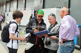 Sergio Perez (MEX) Sahara Force India F1 signs autographs for the fans. 08.07.2014. Formula One Testing, Silverstone, England, Tuesday.