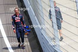 Jean-Eric Vergne (FRA) Scuderia Toro Rosso STR9 walks back to the pits after stopping on the circuit. 08.07.2014. Formula One Testing, Silverstone, England, Tuesday.